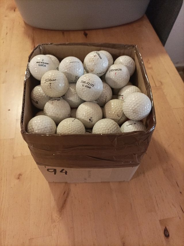 Bolas de golf recuperadas.   54 total
