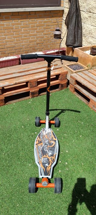 Patinete Oxelo cuatro ruedas 