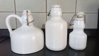 Tris contenitori bottiglie in ceramica