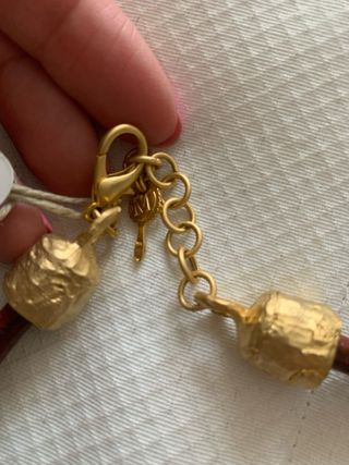 Collar marrón y dorado elefante