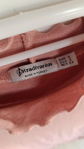Jersey rosa manga larga cuello alto