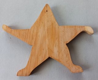 Stella lavorata in legno da appendere