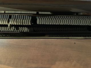 Piano madera siglo XX.