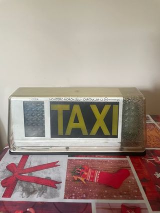 Taxímetro y capilla Taxi