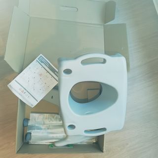 Etac Swift. asiento de inodoro elevado