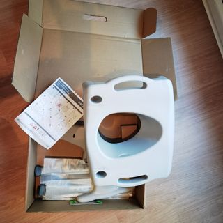 Etac Swift. asiento de inodoro elevado