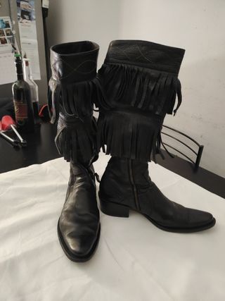 Texani Stivali di pelle con frange.