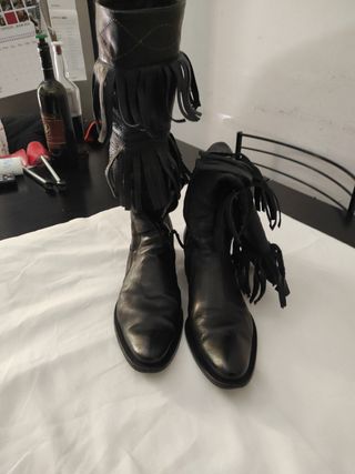 Texani Stivali di pelle con frange.