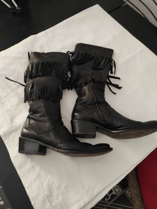 Texani Stivali di pelle con frange.