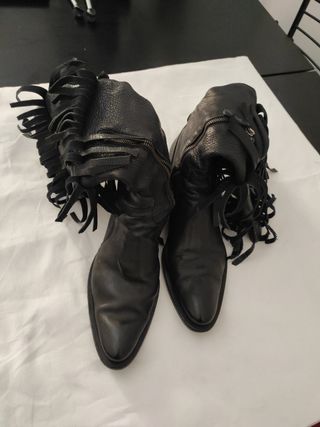 Texani Stivali di pelle con frange.