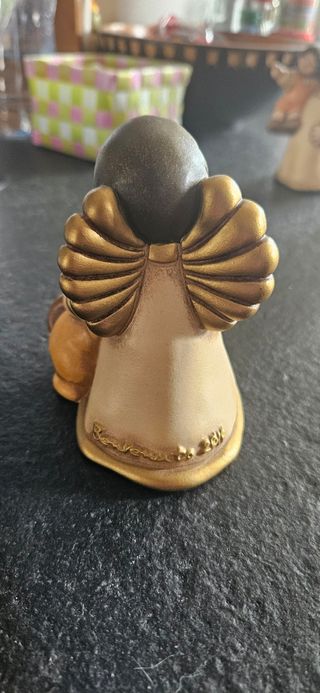 Angelo con cucciolo thun