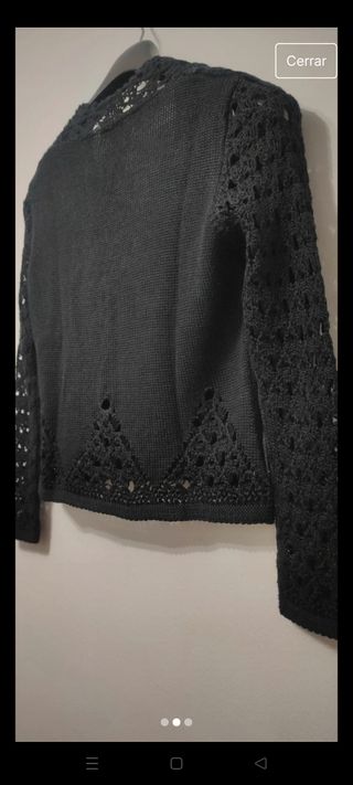 Chaqueta negra calada elegante como nueva