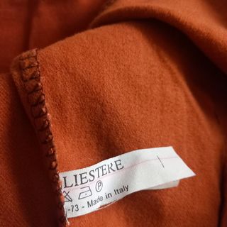 Pantaloni arancioni risvolto leopardato