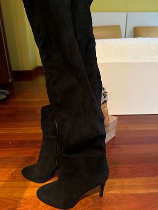 Botas altas encima rodilla