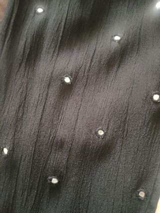 Mono negro sin mangas con bolsillos