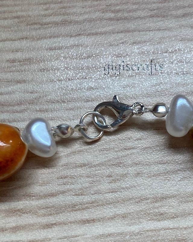 Collar artesanal de cerámica, estrellitas y perlas