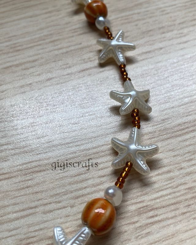 Collar artesanal de cerámica, estrellitas y perlas