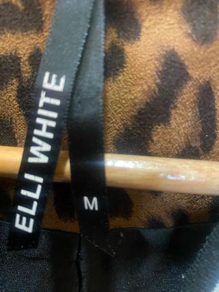 Abrigo corto  animal print marron y negro