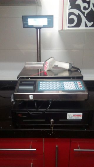 Máquina pesadora registradora
