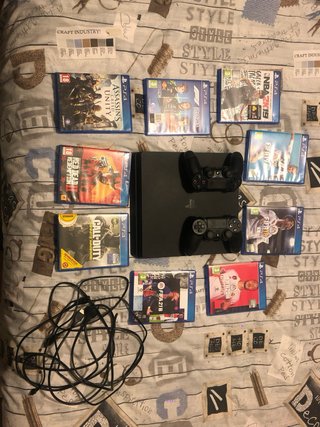 Ps4 slim 1 tb + 2 mandos + 9 juegos