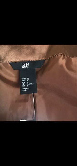 CHAQUETA DE LENTEJUELAS CON ETIQUETA