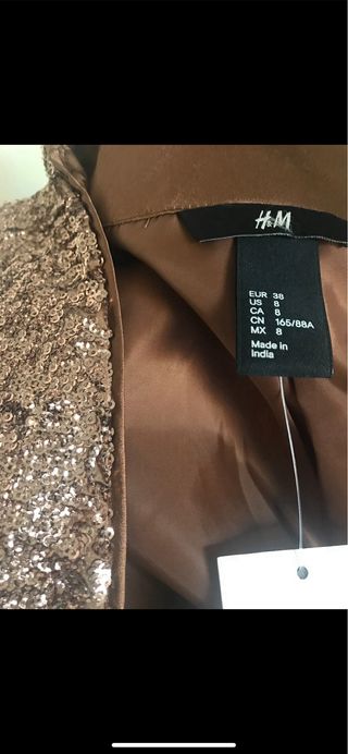 CHAQUETA DE LENTEJUELAS CON ETIQUETA
