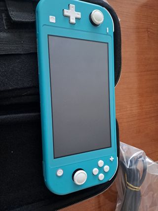 Nintendo switch lite CON FUNDA Y JUEGOS