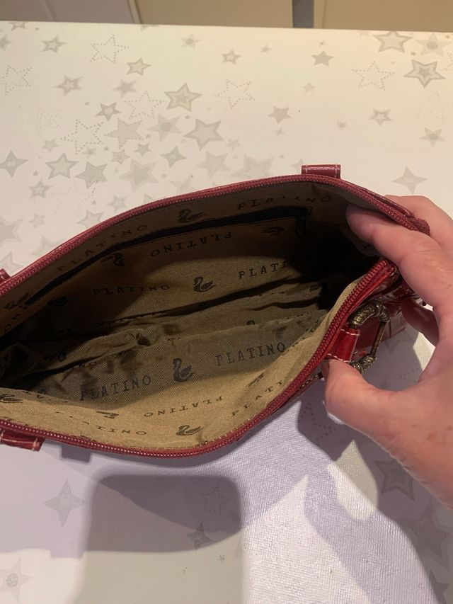 Cartera de mano en piel