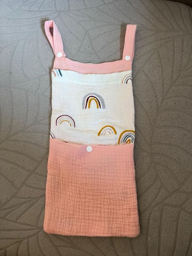 Bolsa almacenamiento cuna,babero plastico y paños