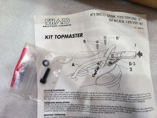 Herraje. Soporte maleta. Kymco Dink 97-06