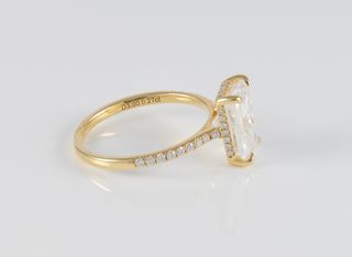 Anillo de compromiso halo oculto oro amarillo 18k