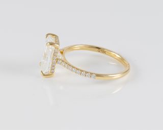 Anillo de compromiso halo oculto oro amarillo 18k