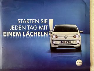 Postal Volkswagen UP retroiluminada