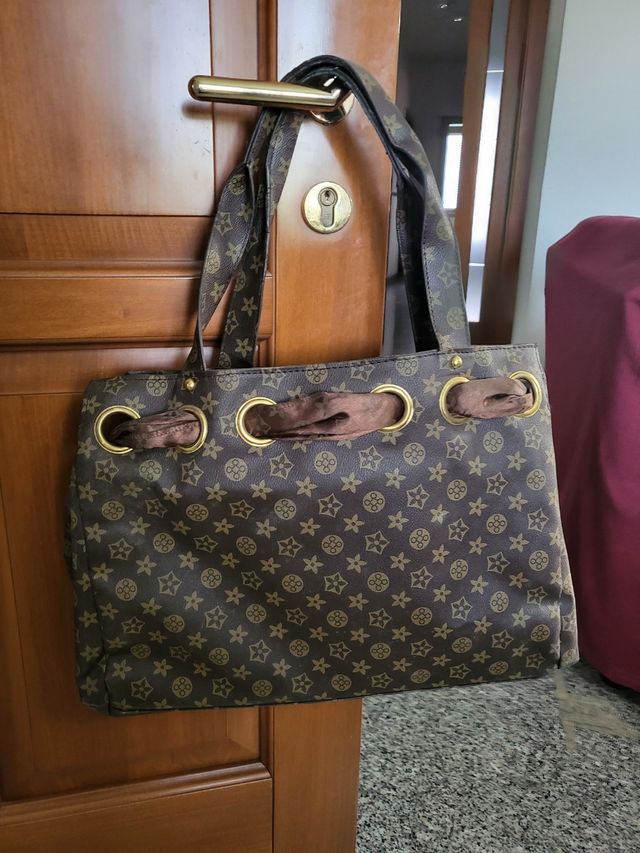 Borsa marrone e oro con simboli