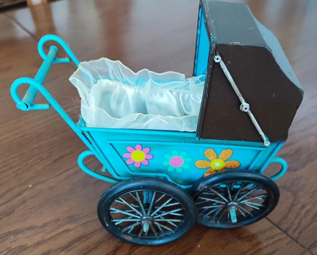 Cochecito muñecas.