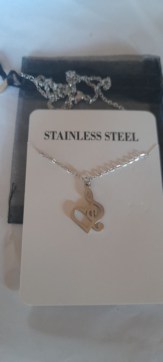 Colgante clave de sol corazon acero