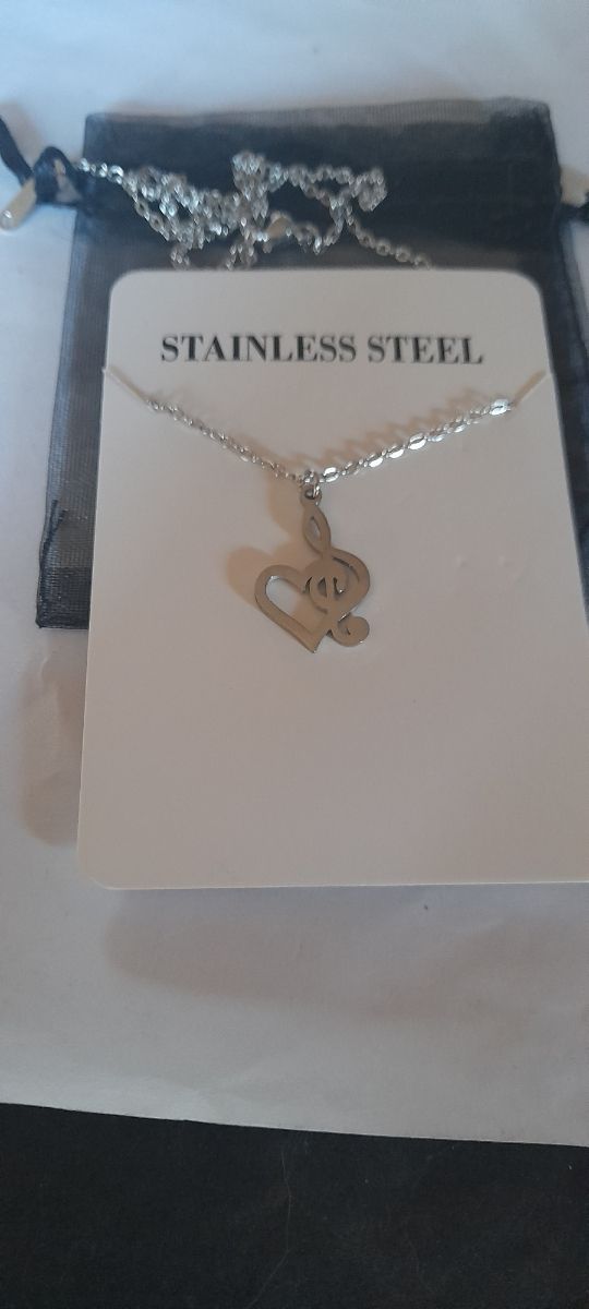 Colgante clave de sol corazon acero