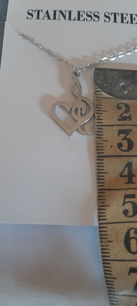 Colgante clave de sol corazon acero