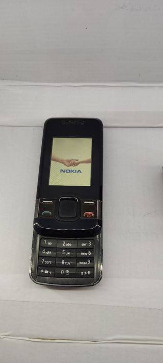 Nokia 7100 con auriculares Bluetooth.