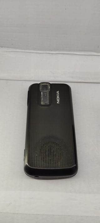 Nokia 7100 con auriculares Bluetooth.