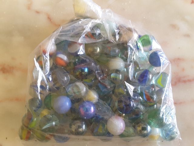 90 canicas de cristal y un bolon