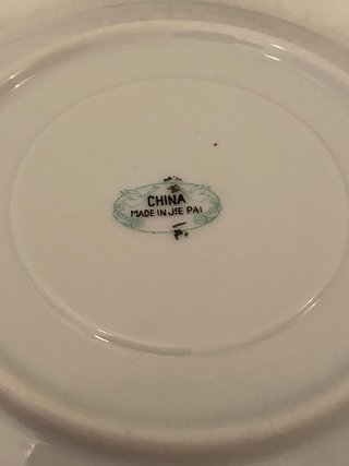 Pareja de antiguas tazas y platos de porcelana