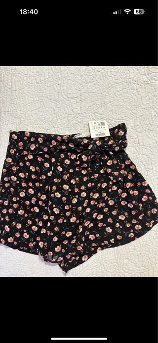 Falta pantalon lazo cremallera flores