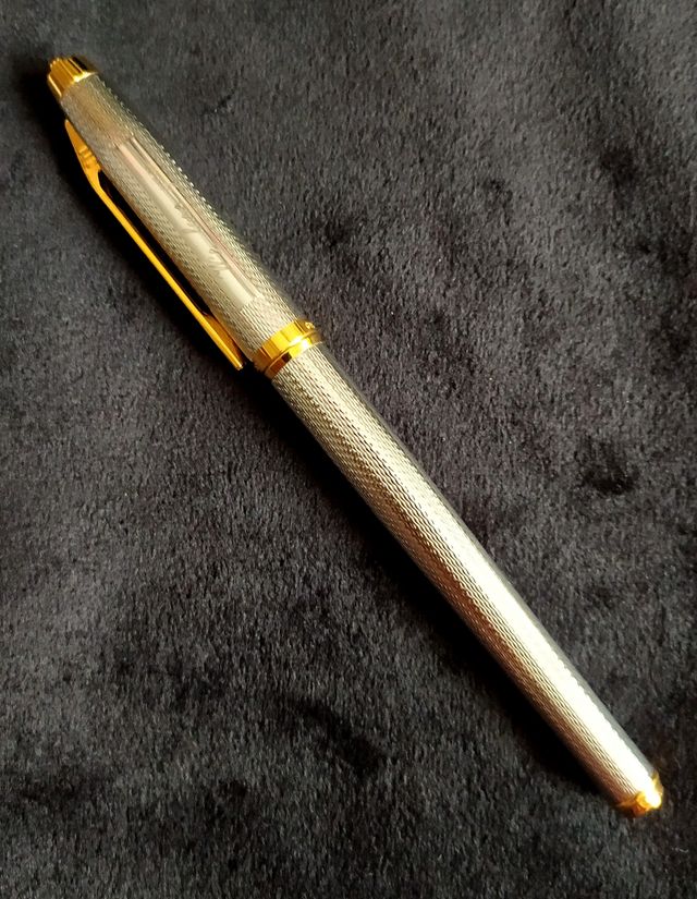 Pluma Elysée acero y oro