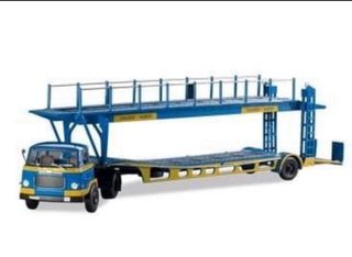 UNIC MZ36 TCA con remolque portacoches