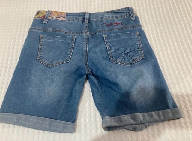 Short corto desigual