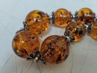 Antica collana in ambra con inserti in argento