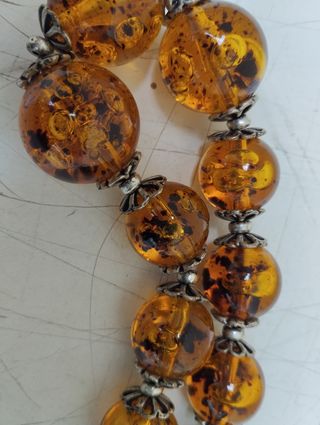 Antica collana in ambra con inserti in argento