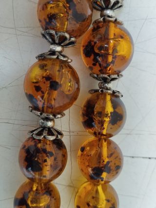 Antica collana in ambra con inserti in argento