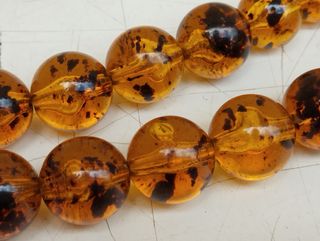 Antica collana in ambra con inserti in argento